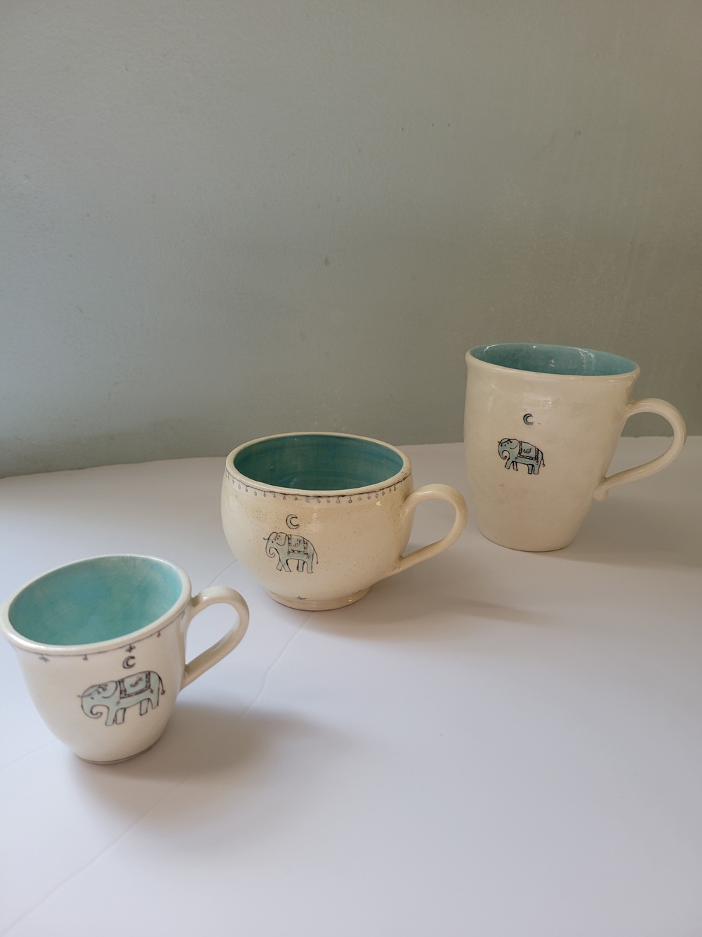 Signed Pottery Ceramic Cream and Turquoise Elephant Mug - Set of 3